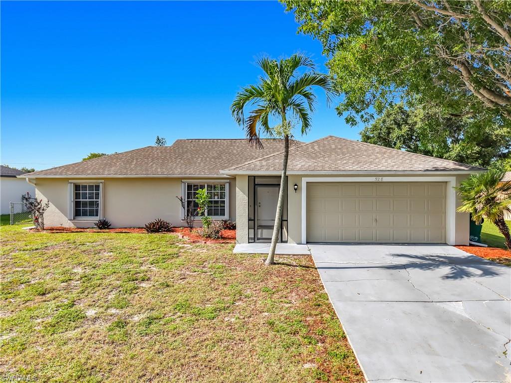 Welcome home to this well maintained 3 bedroom, 2 bath home featuring a spacious open floor plan with vaulted ceilings and plenty of natural light. The split bedroom layout offers added privacy, while the kitchen provides ample cabinet and counter space with a breakfast bar overlooking the main living area. Tile flooring runs throughout the main living areas, with carpet in the bedrooms. Step outside to the screened lanai overlooking the fully fenced backyard, offering plenty of space to enjoy the outdoors. Complete with a 2-car garage and conveniently located near shopping, dining, schools, and major roadways. Easy to show!