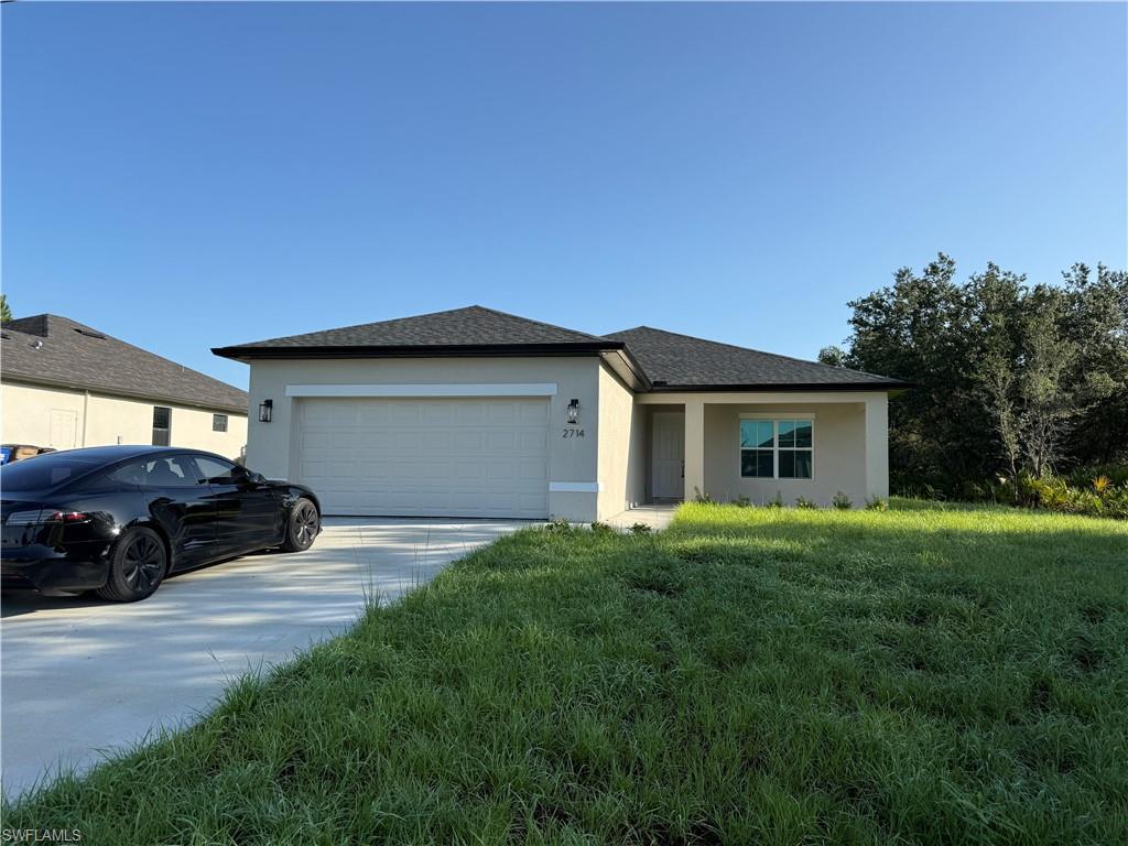 Available immediately for annual rent, this brand-new 2026 construction in Lehigh Acres offers modern living in a peaceful setting. Never lived in, the home features 3 bedrooms, 2 bathrooms, and nearly 1,650 sq ft of thoughtfully designed living space. The open-concept layout showcases a spacious kitchen with a large island—ideal for cooking, gathering, and entertaining. Situated on a 10,000 sq ft lot, the property provides generous outdoor space while maintaining convenient access to local amenities. Additional highlights include Laundry room, Two-car attached garage, Bright, modern finishes throughout A perfect opportunity for anyone seeking a fresh, move-in-ready home in a growing community.