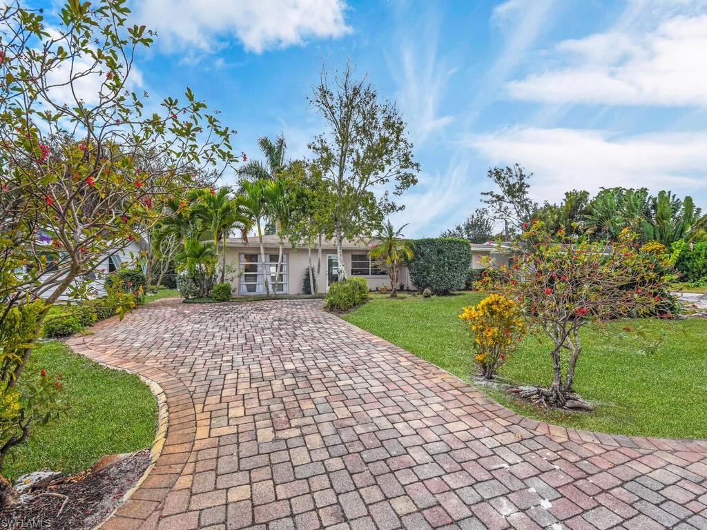 A hidden gem with a location that is second to none.  Located an easy bike ride to the beautiful white sand beaches of the Gulf of Mexico, fine dining and shopping. This 2 bedroom and den 2 bathroom home has been tastefully remodeled. Enjoy the light and bright Florida room with access directly to you patio and private fenced back yard. The yard has plenty of room to add a pool should you desire.