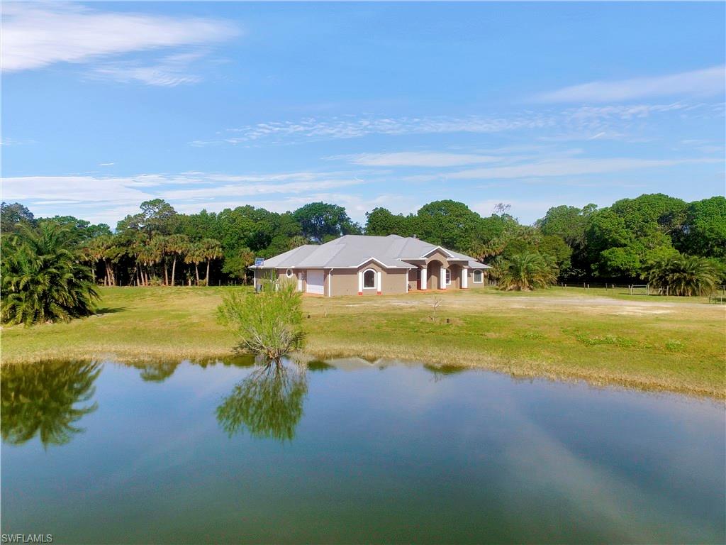 Relax, Play, Work!!!!!!!  With over 10 acres of land you can do whatever your heart desires!!  This beautiful property has everything to offer.  Main home has over 3,000 sf of pristine living, 2 large workshops for all your business/hobby needs, Popash Creek runs through the rear of the property loaded with wildlife, pond in the front, and much more.  Please check out the pictures and virtual tour to get a taste of this spectacular property.  Call today for your private tour!!!