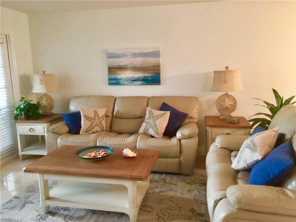 FIRST FLOOR CONDO available in Pine Hollow! Beautiful lake views from your living room, lanai and master bedroom. Tile flooring throughout. Lots of natural light with windows and full glass doors to the lanai. The large bright kitchen has wonderful cabinet space and plenty of countertop for cooking. Wonderful location, close to W Dearborn with a short drive to Englewood beach, shopping, entertainment, and very reasonable condo fees! Carport, A/C, storage closet & w/d. Furnishings are included. This is a turnkey property.