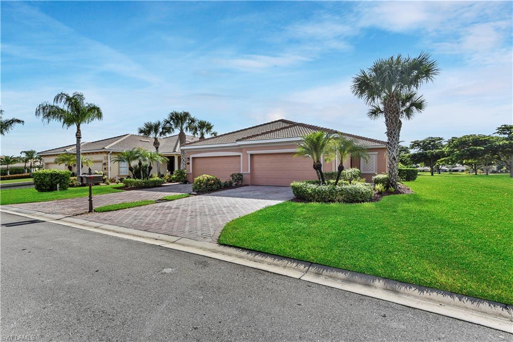Lakefront villa in one of the fastest growing areas of SWFL! This meticulously cared for lakefront attached villa is situated in a highly desired gated community, while also being in one of the fastest growing areas of SWFL due to the proximity to FGCU, Hertz Arena, Miromar Outlets, Coconut Point, and Gulf Coast Town Center. A wonderful low-maintenance home that is perfect for both seasonal & annual living, plus affordable HOA fees that give you access to the manned guard gate & the resort-style amenities that Bella Terra has to offer. Lives like a single family home w/ pavers on the wide drive & walkway leading to a side facing front entry, open concept living design, tile flooring in main living areas, den that could be formal dining space or home office if desired, French pocket door entry to guest suite, lots of storage w/ large closets & 2-car garage, spacious side & backyard, and screened rear lanai w/ view of lake. Bella Terra sits on over 1,000 acres w/ 400 of them being "preserved" and featuring 100 acres of beautiful lakes, a 7k sq  ft clubhouse w/ state-of-the-art fitness center, pool & spa w/ waterfall, aerobics/yoga room, tot lot, bocce ball, tennis courts, and more!