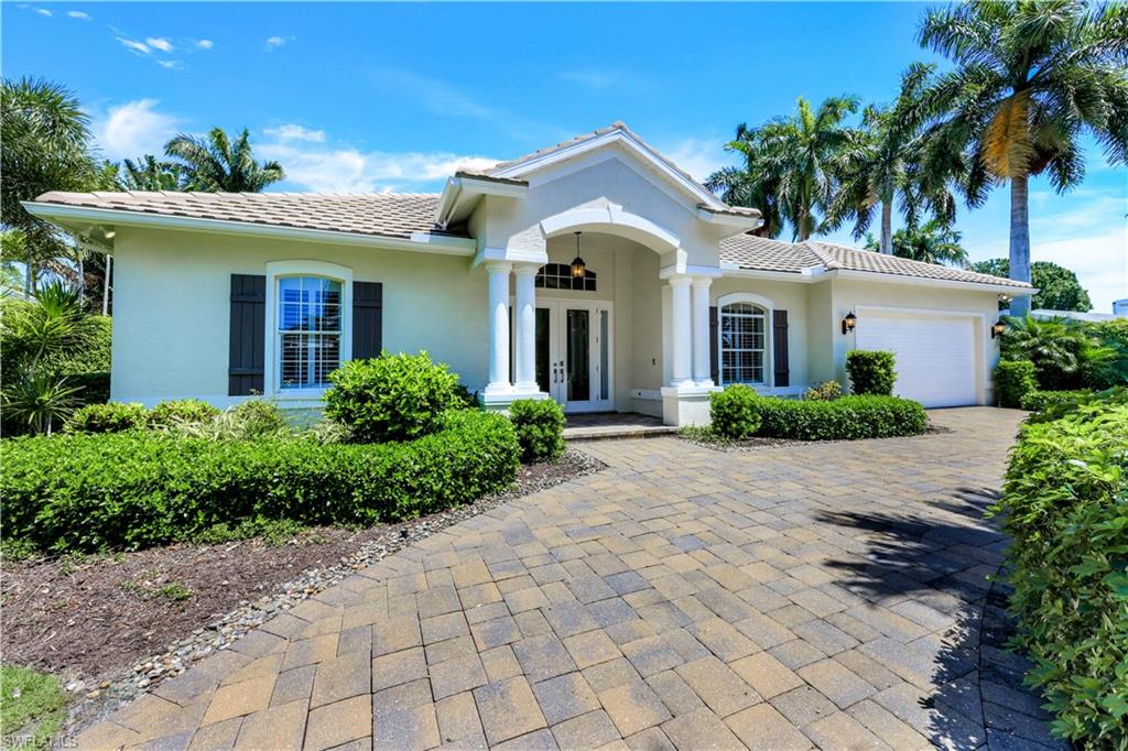 A stylish and newly renovated home in one of the most desirable Moorings locations.  Positioned West of Crayton and a short walking distance to the private Moorings Beach park, this wonderful property on quiet and beautiful Rudder Road, features an oversized .38 acre lot. The home has been luxuriously updated including wide-plank oak floors throughout, marble bathrooms & a gorgeous kitchen with Viking appliances, large island, & high-quality custom cabinetry.  The thoughtfully designed floor plan is bright and open with volume ceilings and a split bedroom layout, offering privacy for you and your guests.  Other great features are an expansive family room with vaulted ceiling, built in bar and electric fireplace feature.  Outside, the tranquil pool area with newer pool cage & travertine patio, is perfectly positioned to provide sunshine throughout the day, and overlooks the private park-like grounds.  This wonderful move in ready home truly has it all—perfect location, updated style and easy access to the Moorings beach park. Please note that the property is currently not furnished and all respective pictures show it virtually staged.