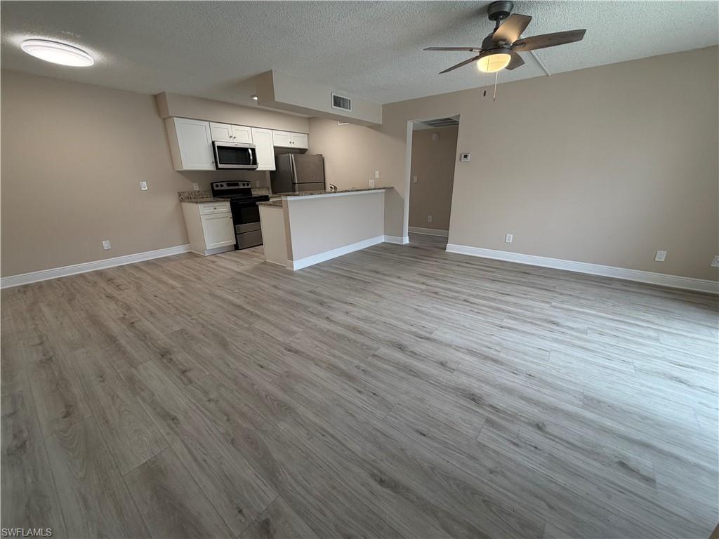 ANNUAL RENTAL - 1 BED / 1 BATH CONDO AT MYSTIC GARDENS in Fort Myers, FL. This first-floor condo offers a remodeled bathroom with granite countertop, a fully equipped kitchen with stainless steel appliances, white cabinets and granite counters, plus luxury vinyl flooring throughout. Enjoy in-unit laundry and a screened, covered lanai that includes an extra storage closet. The community features a pool and a tennis court for recreation. $50.00 monthly charge for water and sewer in addition to rent. Ideal for anyone seeking a well-maintained, move-in-ready 1 bed/1 bath residence in Mystic Gardens.