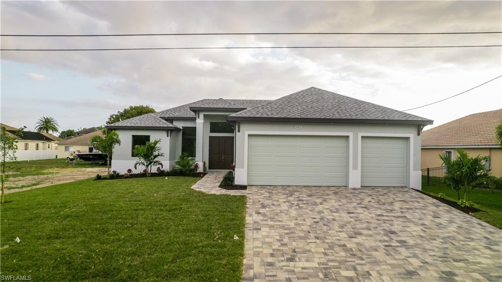 Come see this recently completed New Construction home offer by Fairview Builders with Over 30 years of reputable building in SW Florida.  This is a MUST SEE HOME. Located in the popular and fast growing SW Cape Coral area. Large and open floor plan with approx. 2000+sqft of living area, 3 Car Garage and a beautiful Pool with cage and brick paver decking. Other features include all HURRICANE IMPACT GLASS WINDOWS AND DOORS. (no shutters needed), tile throughout every room, brick paver driveway, high ceilings, 8ft doors, grand entry way, custom lighting, granite counters, kitchen island, real wood cabinets, double vanity in master bath, amazing master bathroom shower, brick paver driveway and the list goes on. This is a great deal for a new home meeting all the latest codes, which means inexpensive insurance, and better energy efficiency. Quality construction home shows great!