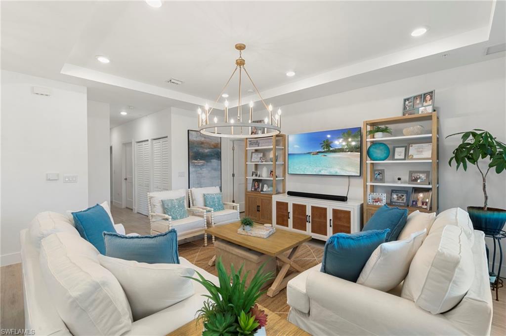TRUE STANDOUT! Move-in ready and offered TURNKEY! END UNIT furnished for your convenience! This exceptional 3-bedroom, 3.5-bath condominium is perfectly located in the heart of Bonita Springs, less than 8 minutes from Bonita Beach. Whether you're seeking the ideal seasonal retreat, investment property, or full-time residence, this beautifully upgraded home delivers luxury, comfort, and an unbeatable Southwest Florida lifestyle. Designed with attention to detail throughout, the residence features luxury wood-look tile flooring throughout the main living areas and bedrooms, upgraded tile in all bathrooms, additional recessed LED lighting, and designer finishes. The kitchen showcases quartz countertops, white shaker-style cabinetry with crown molding, decorative hardware, a subway tile backsplash, under-cabinet lighting, a large island, upgraded Duragranite sink, Moen fixtures, and a GE appliance package. The spacious primary suite offers a spa-inspired bathroom with floor-to-ceiling tile, a mosaic shower floor, frameless glass shower enclosure, quartz countertops, and upgraded cabinetry. Additional highlights include upgraded carpeting with premium padding on the staircase, a custom handrail, prewiring for wall-mounted TVs, impact-resistant windows and doors, and a screened second-floor balcony perfect for enjoying Florida's year-round sunshine. Residents enjoy access to a community pool, fitness center, and a prime location near beaches, dining, shopping, and entertainment. This turnkey residence is ready for immediate enjoyment! Schedule your showing today!