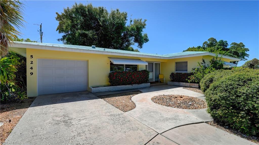 Take advantage of this great opportunity to make this your permanent year round home, retirement home, vacation retreat or even a great rental property!  Located in the popular Cape Coral Yacht Club area on an oversized corner lot within walking or bike riding distance to the popular Yacht Club public beach.  This home is neat as a pin with two bedrooms, 2 full bathrooms, new luxury vinyl flooring throughout, new interior doors, large screened lanai and plenty of opportunity and potential to decorate and make it your own. The home has a metal roof, new A/C installed in 2022 and newer appliances.  There is an extra room, accessed off the rear patio and currently used for storage but could easily be turned into a retreat for a man-cave, work space, hobby room or just extra storage space.   The large screened lanai is great for outdoor dining or relaxing in the shade and the back and side yard allows plenty of room to add a swimming pool.  Call today to make your private appointment to see this home before its too late!