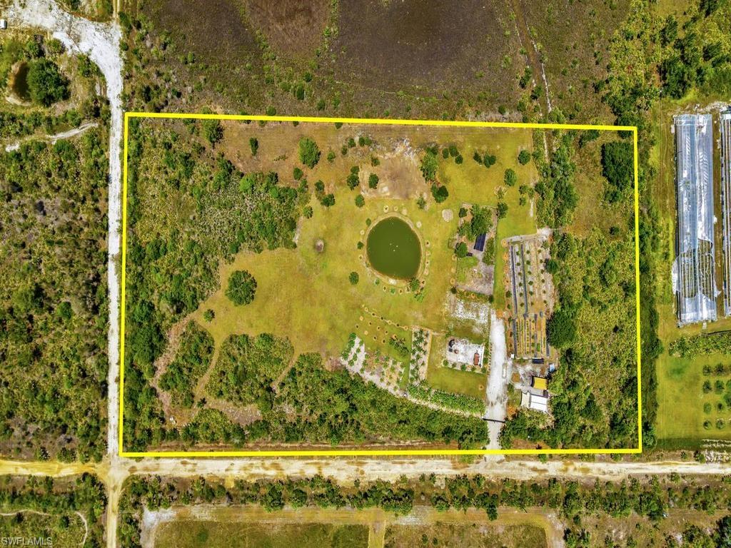 Discover a rare opportunity to own a productive and established 5-acre farm in Golden Ranches. This fully equipped agricultural property features approximately 2 acres of irrigation, a stocked pond with tilapia and catfish, bee hives, chickens, well water, electric service, backup generator, and gated access. The property includes a 12' x 20' steel building with mini-split A/C and heat, hot water tank, janitor sink, refrigerator, stove, washer and dryer, plus an outdoor shower and a 10' x 20' greenhouse. Equipment includes a Husqvarna zero-turn mower with cart.

The farm is planted with an impressive variety of tropical and fruit-producing trees, including multiple varieties of bananas, plantains, papaya, avocado, mango, coconut, date palm, figs, mulberry, blackberry, elderberry, olive, lemon, lime, tangelo, passion fruit, black sapote, Surinam cherry, and more. Mature shade and ornamental trees add beauty and privacy throughout the property. (inventory list attached)

Whether you're seeking a homestead, hobby farm, agricultural investment, or private country retreat, this property offers the infrastructure and diverse plantings already in place. Conveniently located east of Punta Gorda with easy access to SR 31, while still providing the peace and privacy of rural Florida living.