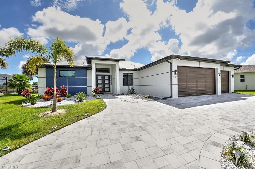 This is an incredible opportunity for someone!! This home was built with quality contractors in 2021 and is a true 4 bedroom 3 bath home with tray ceilings, a feature wall w/electric fireplace and electric shades in the great room, island kitchen w/waterfall countertop and separate dining area.  The primary bedroom features tray ceilings, dual walk-in closets, a walk through shower, 2 vanities, and an electric shade w/slider to the lanai.  Plank tile runs throughout the home.  The screened pool cage encompasses a paved lanai with outdoor kitchen and bar w/ seating area, pool, spa, outdoor shower, and access to the 3rd bathroom.  The captains walk and 10,000 lift w/canopy and electricity overlook a large basin w/a canal leading w/gulf access.  Top it off with the 3 car garage and metal roof - this house is a steal!!