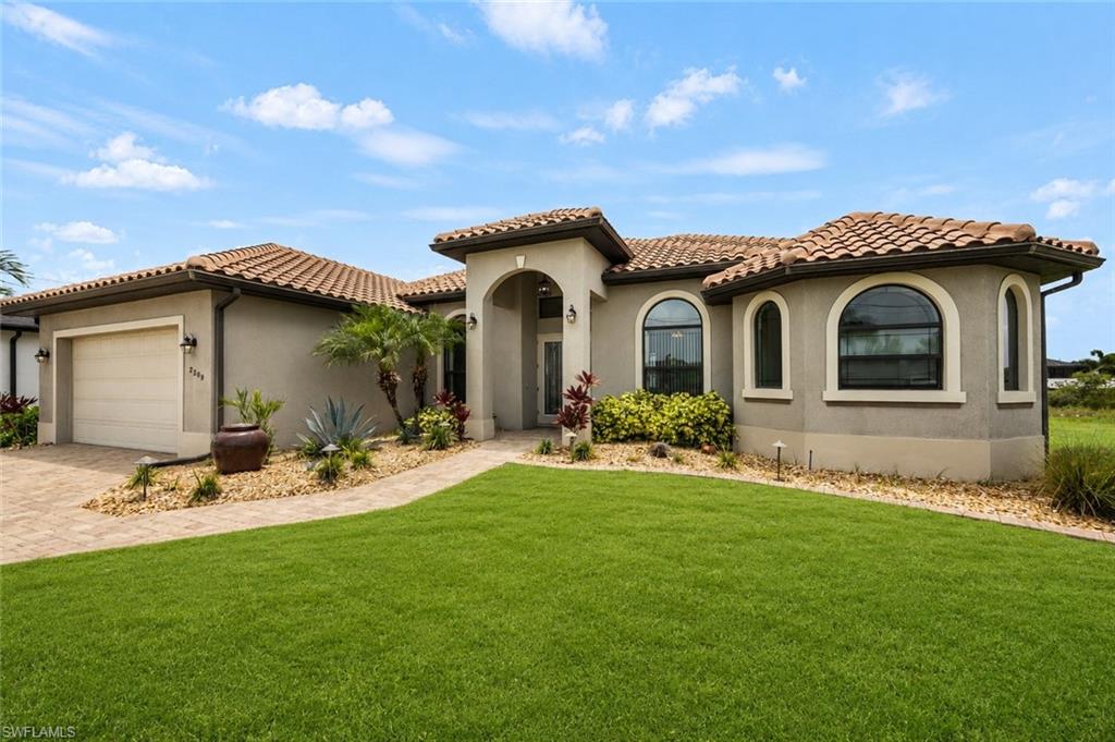 One or more photo(s) has been virtually staged, AI generated or rendered.  WATERFRONT LUXURY WITH GULF ACCESS

Welcome to paradise on prestigious Surfside Blvd in highly sought-after SW Cape Coral. This stunning Gulf-access custom home built by Groff Homes in 2015 offers nearly 2,500 sq ft under air with 3 bedrooms + den, 3 baths, and breathtaking canal views surrounded by newer luxury homes.

Offered fully turnkey, this home is ideal as a luxury residence, vacation retreat, or successful Airbnb investment. The open-concept floor plan features soaring ceilings, tray ceilings with crown molding, 8-foot doors, impact windows and sliders, whole-home surge protection, tile and engineered wood flooring, and abundant natural light throughout.

The gourmet kitchen showcases solid wood soft-close cabinetry, granite countertops, designer backsplash, stainless steel appliances, pendant lighting, breakfast bar, and spacious eat-in area overlooking the waterfront family room.

The oversized primary suite offers a private sitting area with lanai access and a luxurious spa-style bath with dual vanities, soaking tub, and oversized walk-in shower.

Step outside to your tropical resort featuring a freshly painted interior (May 2026), expansive screened paver lanai, solar-heated pool with illuminated waterfall, lush landscaping, and stunning eastern exposure sunrise views.

Boaters will love the Gulf access with only two bridges to the Spreader Canal, with oversized Captain’s Walk V-Dock, 8,000 lb boat lift, and exceptional fishing and boating directly from your backyard.

Additional highlights include a tile roof, formal dining room, den/office easily used as a 4th bedroom, large under-truss lanai, all assessments paid, and a prime location near shopping, restaurants, medical facilities, and miles of biking trails.

The elegant double-door entry welcomes you into spacious living areas designed for entertaining and everyday luxury. The family room and primary suite both overlook the sparkling waterfront pool area, creating a seamless indoor-outdoor Florida lifestyle. Mature tropical landscaping surrounds the property, enhancing the private resort-style setting. This highly desirable location in SW Cape Coral is surrounded by upscale waterfront homes and offers quick access to boating, dining, and entertainment.

As an added bonus, the adjacent lot next to the property is also available for purchase, creating a rare opportunity for additional privacy, expansion, or investment potential. SpaceCoast, MLS #1052626

Luxury, boating, income potential, and breathtaking waterfront living all come together in this exceptional SW Cape Coral home. Schedule your private showing today.