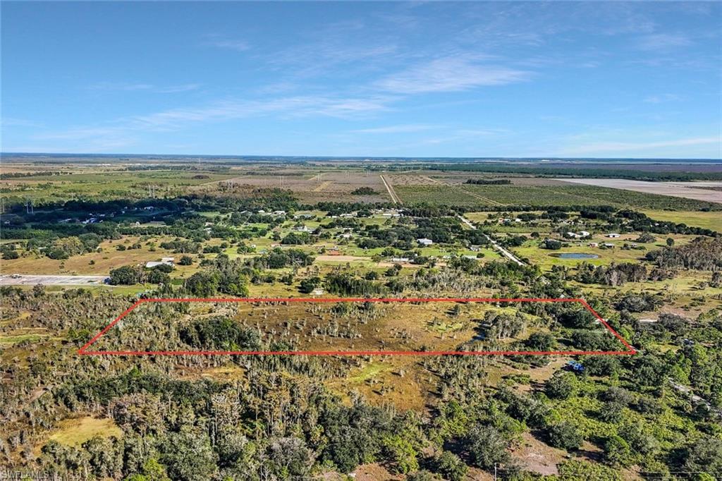 Dreaming of a place where mornings begin with golden sunlight and the sound of birds instead of traffic? This 6-acre AG-2-zoned property offers the freedom and space to build the life you’ve been craving — whether that’s a sprawling ranch, a charming farmhouse, or your very own private equestrian retreat. Tucked away from the noise yet still close to all the conveniences of Fort Myers, this land captures the best of both worlds — peaceful country living with modern amenities just a short drive away. The AG-2 zoning gives you options: bring your horses, grow your own garden, or simply enjoy wide-open skies and endless possibilities. Imagine weekends spent riding through open fields, gathering with friends around a bonfire, or watching sunsets paint the sky in shades of coral and gold. This isn’t just land — it’s a chance to slow down, breathe, and create your own piece of paradise. If you’ve been waiting for the perfect balance between country serenity and city convenience, this 6-acre AG-2 property is where your story begins.