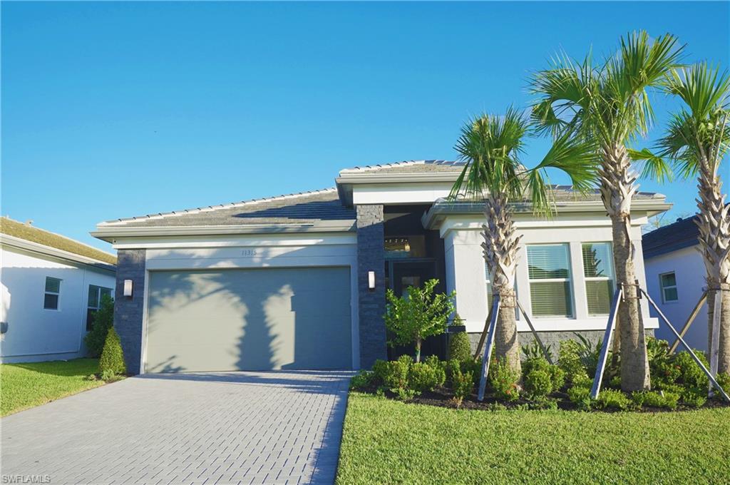 MOVE IN NOW! Better than new, this home has been done for you and is available NOW! Prepare to enjoy the Naples lifestyle with this spacious "Flamingo" floorplan, 2+ den, 2 Bath, Extended 2-car garage, and impact resistant windows throughout, Bonus options include custom closet shelving, outdoor lighting, screened in entrance plus much more. Offering perfect entertaining space, boasting a luxury kitchen with SS appliances and Quartz countertops. Main bedroom overlooks the screened patio & pool, with two walk-in closets. This features an exceptional lifestyle with resort-style amenities at the 43k sqft. clubhouse, including the resort-style pool, 70 ft. lap + resistance pool, firepit, w/restaurant, social hall, dance floor and stage, fitness center, salon, and more. Situated on 160 acres of pristine preserve with 3+ miles of walking trails and endless activities including pickleball, tennis, bocce, dog park, and more. Valencia Trails is located just minutes away from shopping and dining and provides a new standard of 55 plus living by offering an exciting vacation-inspired lifestyle that rivals the finest resorts with something for everyone to enjoy. Videos are from GL