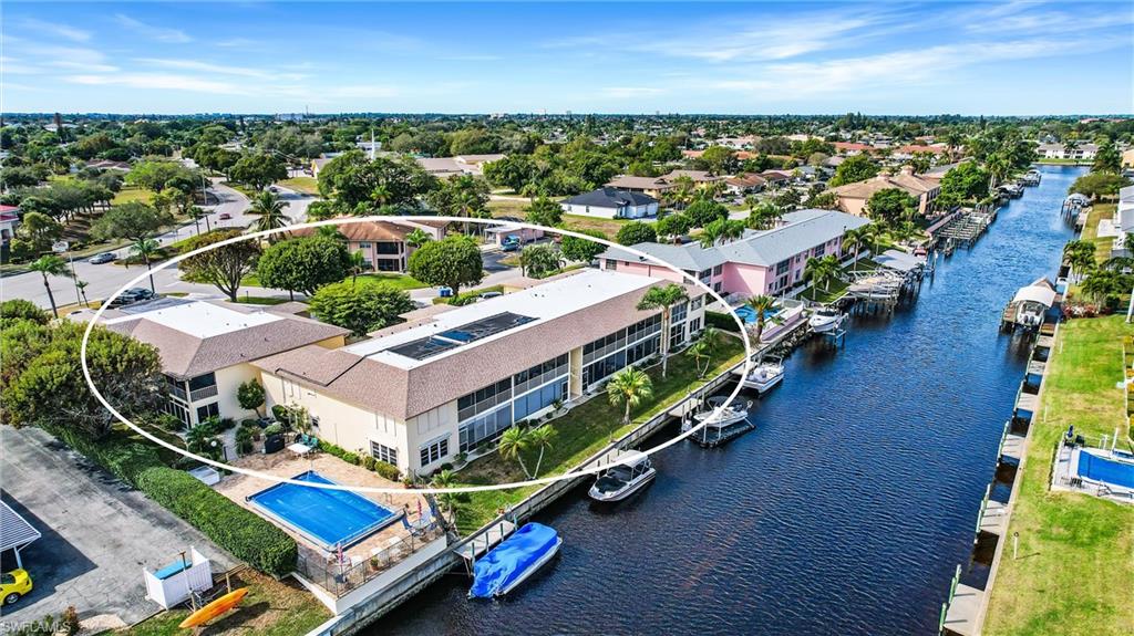 *Untouched by storm, no damage to this furnished unit. Ready for Immediate Occupancy*
 Gulf Access Waterfront Condo with Garage. This 1st floor unit has 2 bedrooms, 2 baths, and luxury vinyl plank flooring throughout. A large screened lanai overlooking the canal, plus a 1 car garage. Enjoy watching the boats sail by from right off your oversized private screen lanai. The solar heated community pool is just steps away from this unit. Boat dockage is first come first serve. This 55+ community has low maintenance fees and is centrally located close to downtown Cape Coral, shopping and dining. You'll love the great neighbors in this very social tight-knit community.