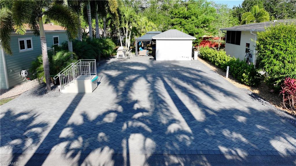 Welcome to Lot B26 in Cypress Woods RV Resort, Fort Myers, FL — a rare opportunity to own an exceptionally private, beautifully upgraded RV lot in one of Southwest Florida’s premier gated RV communities. This spacious approximately 4,100 sq ft property is fully pavered and thoughtfully designed for comfortable outdoor living and entertaining. Mature foxtail and pygmy palms provide superior shade and create a lush tropical atmosphere, while the lot’s unique positioning offers outstanding privacy with no rear neighbors.
The rear entertainment area features a stunning 12x16 hard-top gazebo complete with electric and powered privacy curtains, creating the perfect setting for relaxing or hosting guests year-round. A Paradise BBQ and all outdoor furniture are included, making this property completely move-in ready.
The fully finished accessory building offers added comfort and convenience with a washer and dryer, tankless water heater, shower, toilet, and air conditioning — ideal for extended stays or full-time RV living.
If you’ve been searching for a private tropical retreat with premium upgrades and exceptional outdoor living space, Lot B26 is a must-see. Reach out today — this one will go fast!
