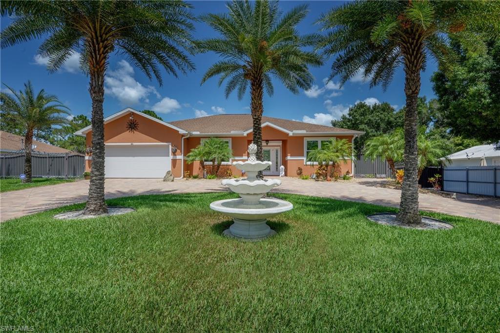 Motivated seller - bring us an offer! Must see this one-of-a-kind Energy Efficient home that has been designed to withstand Florida’s weather & keeping your expenses way down! All the windows & doors are hurricane grade ($13,500) & also have 2 layers of thermal tint to keep the heat out & cool air in ($4,000) & all LED lights. The home also features a tankless water heater, double reverse osmosis system, 300 gallon holding tank, automatic sprinkler system, brand new 5 ton A/C unit that cools the 2 1/2 attached garage also. The kitchen is equipped with Kitchen Aid s/s appliances & wine cooler, wood cabinets, granite countertops and a breakfast bar. The home sits in a half acre and is completely fenced with hurricane grade Steele ($60,000) and features flawless Floratam grass, a concrete pad for your RV, an above ground pool, heavily insulated pavilion, detached storage shed and 3 auxiliary carport areas-plenty of room for all of your toys. Other updates include new exterior paint, seamless gutters, hurricane roll down for the front door, huge circular driveway and a beautiful fountain in the front with a LED light system.