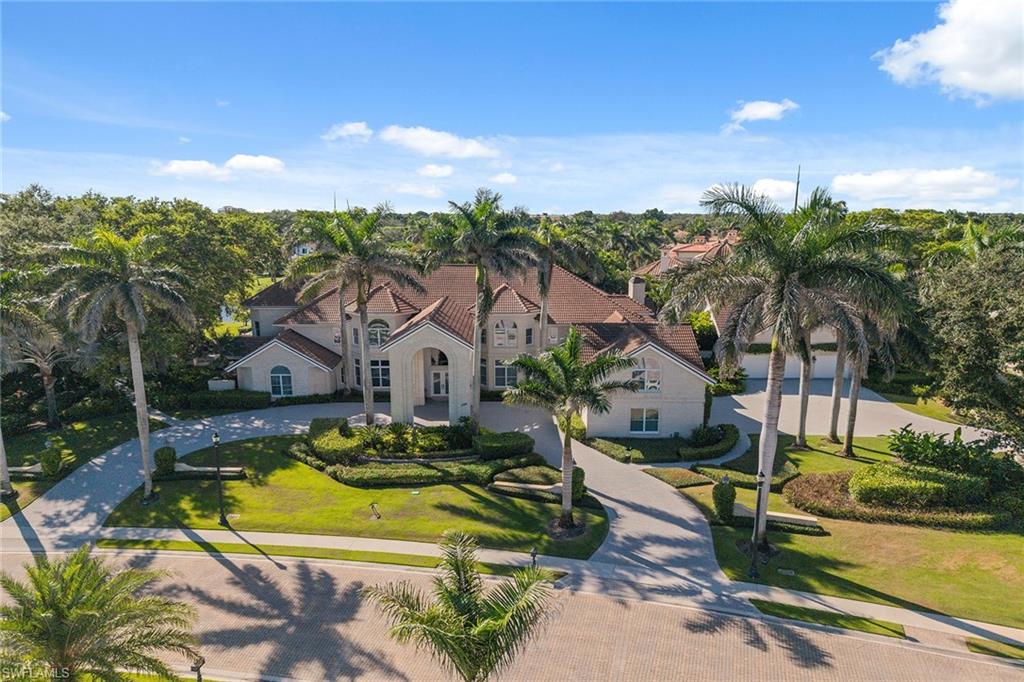 Exceptionally rare opportunity in the exclusive Bay Colony Shores neighborhood. Graciously situated on nearly an acre encompassing two lakefront homesites, this distinguished estate comprised of over 10,000 square feet of living area with eight bedrooms and nine-plus baths including a first-floor main suite and a separate guest apartment. Architecturally defined by attention to quality and detail, this home is designed for relaxed and gracious living. The luxuriously landscaped grounds feature a pool side cabana, gazebo and a 3,200 square-foot micro-screen enclosure surrounding a saltwater 74-foot lagoon-style pool and spa. The car enthusiast will be delighted with the two air-conditioned three-car garages. Bay Colony residents can enjoy the privilege of being members of the private beach and tennis clubs.