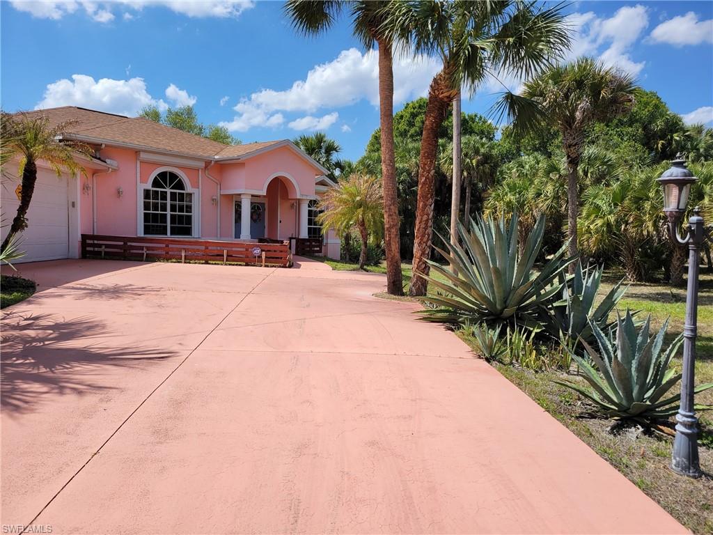 This gorgeous custom home is fully furnished and equipped with everything you need, just come with your suitcase and move in. There are dishes, pots and pans, towels, bed sheets, decoration, TV, internet router etc. too many extras to mention...
It is situated on 1/2 acre landscaped lot and features 3 bedroom and 3 full bath, living and dining room, kitchen with pantry, utility room and 2 car garage, large enclosed lanai with heated pool. Master bath offers large shower with dual sinks and jacuzzi (aroma spa). Roof was replaced 2018, newer A/C, comes with all appliances, washer and dryer also 2 bar refrigerator and a freezer on lanai for serving your parties. This home has roll down hurricane shutters for each window and door all around the house. The owner spend $ 40,000.- on that. Everything is like new, it was only used from the owner a couple of weeks out of the year as vacation home.
There are security lights on the property from LCEC and a security system ADT pulse with cameras inside and outside.
ADJASING LOTS 509 + 513 North Ave are also available.
