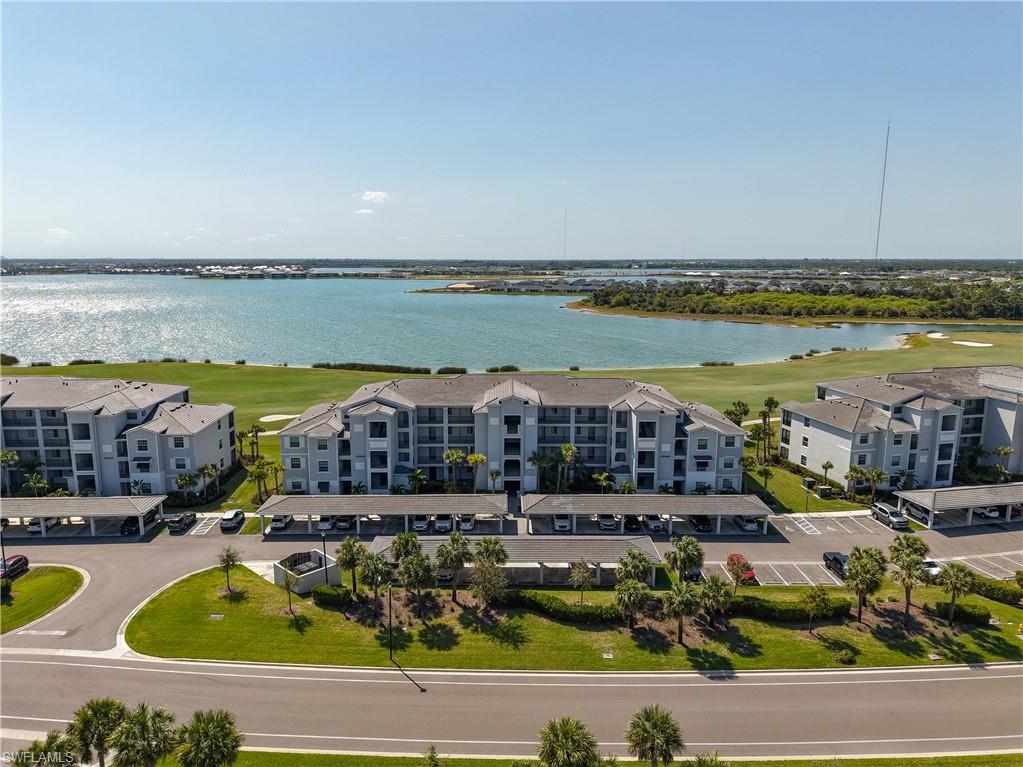 Experience effortless Florida living in this beautifully appointed first-floor Carolina model featuring a Transferable Golf Membership in the highly sought-after Babcock National Golf & Country Club. Perfectly positioned to capture breathtaking, million-dollar lake views and unforgettable Southwest Florida sunsets, this 3-bedroom condo offers the ideal blend of luxury and tranquility. The open-concept layout features a spacious kitchen with a center island overlooking the dining and living areas, creating the perfect space for entertaining or relaxing after a day on the course. The private primary suite, generously sized guest bedrooms, and convenient exterior storage closet complete this thoughtfully designed home. Enjoy resort-style living with a championship golf course, designed by Gordon Lewis. Featuring a spectacular clubhouse, resort pool, Watershed Bar & Grill, Enclave elevated dining restaurant, tennis, pickleball, fitness center, spa, and an active social calendar. As a resident, you'll also enjoy all the amenities and conveniences of Babcock Ranch, America's premier solar-powered town. This is your opportunity to own one of the most desirable first-floor lakefront condos in Babcock National, where every evening ends with a spectacular sunset right from your lanai.