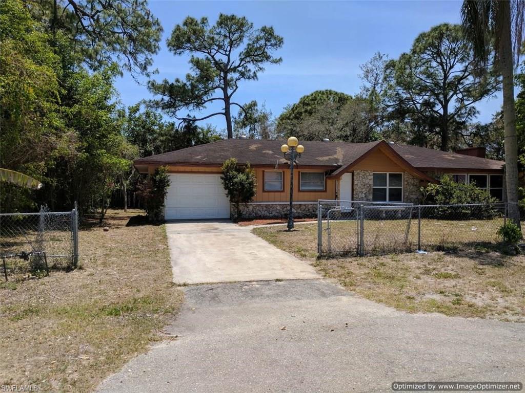 STOP AND LOOK AT THE POTENTIAL!!!!!!!  This 3 Bedroom 2 Bath home features a MASSIVE OPEN Great Room, Formal Dining, Wood Burning Fireplace, Screened Lanai, 1 Car garage!!!!!  All of this is situated on a close to 1/2 Acre Site with an Additional 2 Car Detached Garage and Partially Fenced Yard!!!!!   CITY WATER AND SEWER!!!!!  There are many things you can do with this property --  come and see.  Great Property for someone who needs to store equipment or use the Deatached Garage as a Workshop!!!!   SELLER IS MOTIVATED AND OPEN TO ALL REASONABLE OFFERS.  SELLER SAYS -- LETS MAKE A DEAL!!!!!