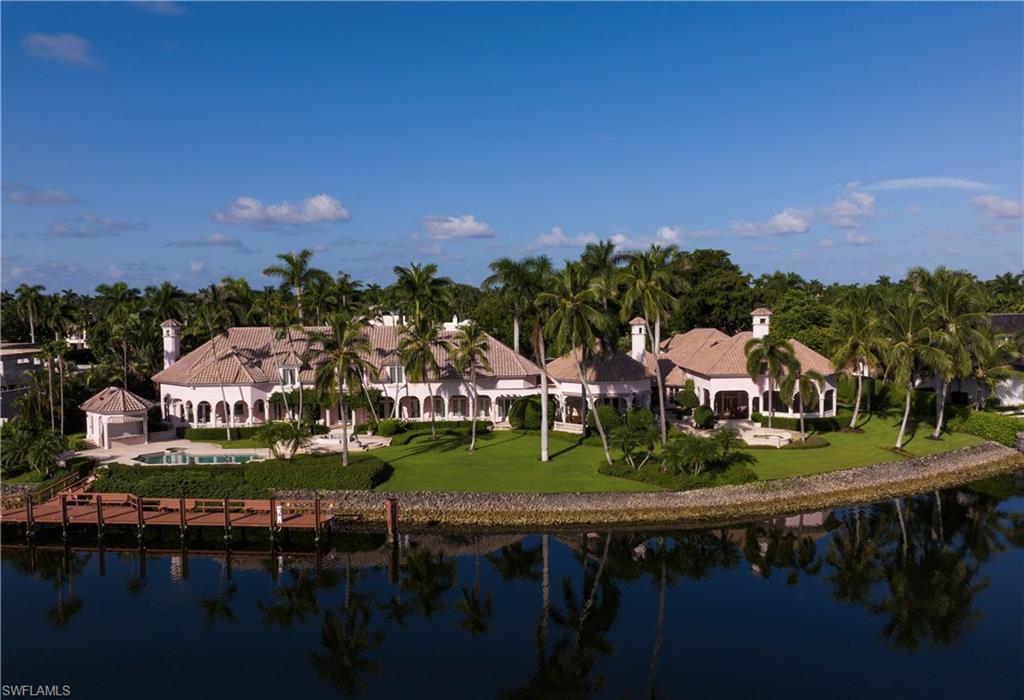 Now available, an assemblage of two and one half Port Royal lots overlooking the magnificent wide water of Morgan's Cove with approximately 313 feet of water frontage (per plat and/or deed). One of the most desired panoramic water views in Port Royal with room for a significant yacht. The extraordinarily large building envelope coupled with the substantial water frontage allows for a myriad of exciting design opportunities.  A gracious residence, originally built in 1994 and then significantly renovated and added on to in 2002 by one of Naples most sought after builders, Newbury North Associates, currently resides on the property in a charming relationship with the expansive and superbly landscaped grounds that surround it.  This rare opportunity is in close proximity to all of the Port Royal Club amenities. Morgan's Cove is the perfect location for a boater, with direct access to Gordon Pass and the Gulf of Mexico or just moments from the inland waterways leading south to the fly fishing estuaries of the Ten Thousand Islands. Port Royal Club membership eligibility.