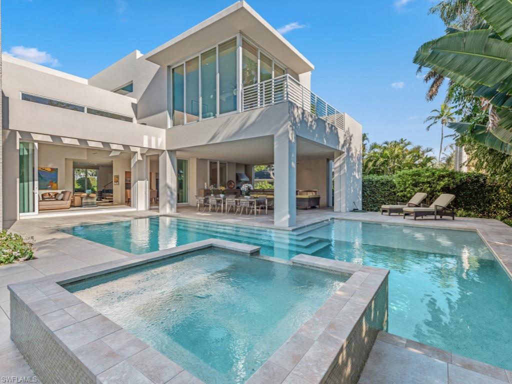 Tucked away on a quiet street in the heart of The Moorings, 440 Spinnaker Drive presents a refined blend of architectural intention, privacy, and timeless Naples living. Built in 2016, this custom residence sits on an oversized homesite with desirable southern exposure, delivering natural light throughout the day and an effortless connection between indoor and outdoor spaces.
Clean modern lines, expansive glass, and thoughtfully curated finishes define the home’s aesthetic. The interior feels open yet grounded—designed to accommodate both intimate living and large-scale entertaining without compromise. Subtle architectural elements, from floating stair details to statement lighting and layered textures, elevate the experience without overwhelming it.
The kitchen and main living areas flow seamlessly toward the outdoors, where lush landscaping frames a resort-style pool and spa. Covered and open-air spaces invite year-round enjoyment, whether hosting guests or simply settling into the rhythm of everyday life in one of Naples’ most established neighborhoods.
The primary suite offers a private retreat with calming views and a spa-like atmosphere, while guest accommodations and flexible bonus spaces provide versatility for work, wellness, or extended stays. Storage, functionality, and comfort were clearly considered at every turn.
Located just blocks from the Gulf beaches, the private Moorings Beach Park, and the Four Seasons Resort, this home delivers a rare balance of tranquility and proximity—central, yet removed.
?This is a residence that reveals its value not through numbers, but through presence.