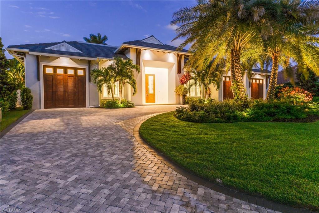 This newly constructed contemporary coastal home in Pelican Bay features clean lines counterbalanced by warm Caribbean-inspired architectural elements invoking notions of a carefree, but sophisticated Naples lifestyle.  The floor plan brilliantly blurs the lines between indoor and outdoor living, with the combination of an expansive great room and island kitchen that transition seamlessly to the outdoors under a stunning vaulted ceiling with beams.  The kitchen is outfitted with solid wood custom cabinets, quartz countertops and a 13’ quartz breakfast island as well as Sub-Zero and Wolf appliances.  The masterful layout continues with an incredible outdoor living space that includes a pool with spa and sun shelf, as well as a summer kitchen with a large quartz island.  The residence offers 4 en-suite bedrooms with a split master, study, bonus room and 3-car garage.  Other notable features include engineered wood floors, Anderson impact glass windows, fireplace, wine room and home automation systems.   You’ll want to see this spectacular home in Pelican Bay where residents enjoy unrivaled amenities including private beach access, beach club, restaurants and more!