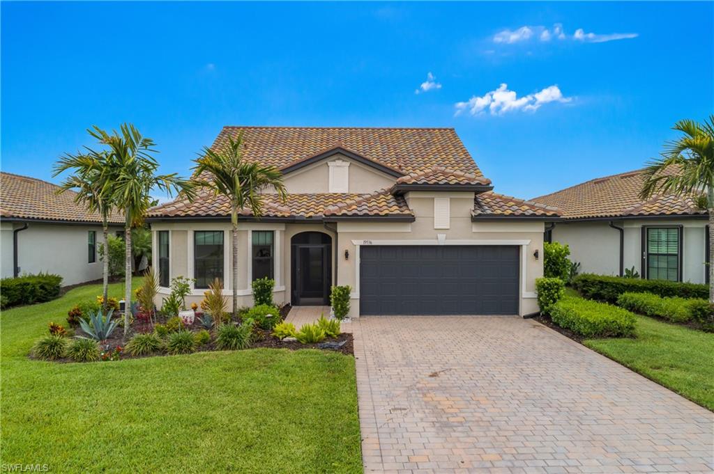 Move in ready and thoughtfully upgraded from top to bottom, this exceptional Pulte Summerwood floor plan offers designer finishes, outstanding indoor and outdoor living spaces, and stunning western lake views in The Place at Corkscrew. Every detail has been carefully selected to create a home that is as functional as it is impressive.

The first floor features an open and bright living area with tile flooring throughout, upgraded lighting fixtures and ceiling fans, and a sophisticated custom wet bar accented by a striking feature wall with an electric fireplace that creates a stunning focal point. The designer kitchen is equipped with quartz countertops that continue seamlessly into a full-height quartz backsplash, overlit and underlit cabinetry, stainless steel appliances, an oversized island, and abundant counter space for meal preparation and gathering.

The spacious first floor primary suite showcases a custom accent wall that adds an elegant designer touch. The primary bathroom features dual vanities, a large walk in shower with a frameless glass enclosure, and generous storage. Upstairs, plush carpeting extends throughout the additional living space, which includes a massive 26 by 18 loft, an additional bedroom, and a full bathroom, providing flexibility for guests, hobbies, or a second living area. A first floor den offers even more versatility for a home office or study.

Step outside to an incredible backyard designed for enjoying Southwest Florida year round. The expansive paver lanai features a custom outdoor kitchen with a built in grill, a resort style pool with an integrated spa, twin waterfall fountain features, and a panoramic screen enclosure that maximizes the breathtaking western lake views and spectacular Florida sunsets. A paver driveway and tandem garage with space for a golf cart or additional storage complete the exterior.

Located within The Place at Corkscrew, residents enjoy one of Southwest Florida's most impressive resort style communities with a spectacular pool featuring a waterslide, a two story fitness center, tennis, pickleball, bocce, basketball, volleyball, a dog park, playground, restaurant, café, bourbon bar, and an active calendar of social events. Conveniently situated near shopping, dining, entertainment, golf courses, and Southwest Florida International Airport, this exceptional home delivers an outstanding combination of style, upgrades, and location.