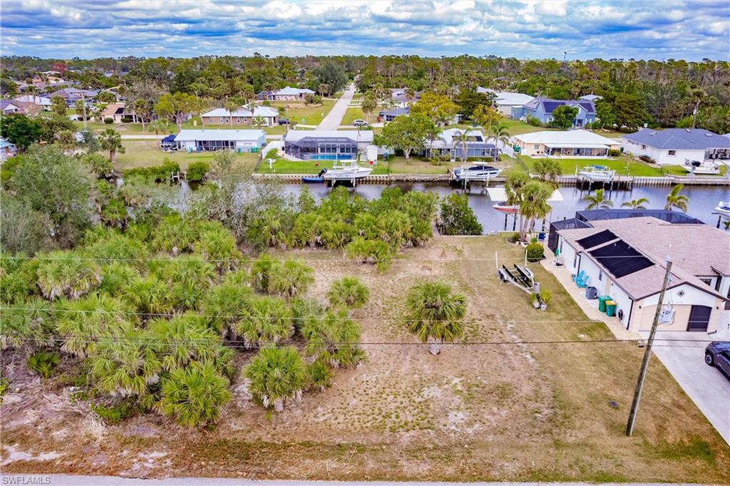 PRICE IMPROVEMENT!   Quiet street, Amazing location ...access to the GULF! Amazing opportunity to build your dream home on this gorgeous homestead, nestled on a very desirable lot with dock and concrete seawall. Enjoy quick access to the Gulf with just one bridge to navigate! Build your waterfront home today!