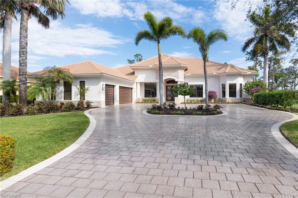 Nestled in the prestigious Riverbrooke neighborhood of West Bay Club, this stunning 5-bedroom, 6-bathroom newly renovated estate home offers over 5,300 square feet of luxurious living and is designed for both comfort and entertaining family and friends. This masterfully reimagined residence features elegant large format porcelain tile and French oak wood flooring throughout, smart home technology including a seven-zone audio system, full home generator, hurricane impact windows and doors, gourmet kitchen with two expansive islands, designer ceiling feature, soft close cabinetry, quartz countertops and backsplash, walk-in pantry, and premium appliances. The home boasts not one, but two deluxe master suites with elegant ensuite baths, luxury plumbing fixtures, custom closets and access to the lanai. Additional living areas include a dedicated office, second-floor balcony and flex room and suite, perfect for a media room, lounge area or private retreat for visiting guests. Step outside to spectacular lake and golf course views from the expansive outdoor lanai featuring picture window screened pool cage, marble pavers, saltwater pool and spa, outdoor kitchen with custom cabinets, granite countertops and backsplash, composite undermount sink, undercabinet ice maker and beverage refrigerator and Hestan gas grill and hood. West Bay Club is a premier lifestyle community that is very inclusive, in that all of the amenities other than the private golf club are included in the HOA fees. These amenities include a brand-new private Beach Club with a restaurant/bar and chair/towel service directly on the Gulf, the newly renovated Bay House with a resort-style pool, Aqua Cafe restaurant, and a state-of-the-art fitness center. Also, River Park with fishing pier, boat launch with Gulf access, kayaks/canoes, playground, boat storage, basketball court, 6 pickleball courts, 8 Har-Tru clay court tennis facility, Bocce, and 2 dog parks. Memberships are also available for the private 18-hole Pete and PB Dye golf course and clubhouse.