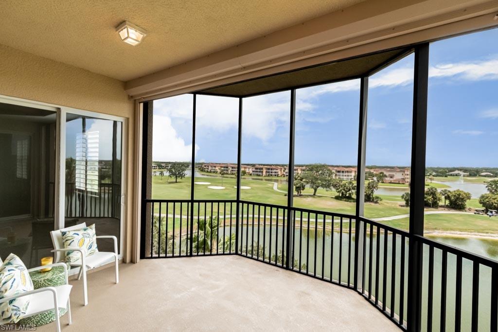 Exquisite 5th floor condo with elevator, incredible million dollar view, 2 En-suite Bedrooms+ large Den, 2 Full baths, 2 Deeded parking spaces and plenty of guest parking! The open, versatile and split bedroom floor plan features 18" diagonal tile flooring in main living areas, hardwood floors in master & den, Plantation Shutters, all new lighting/fans, Granite kitchen w/new stainless steel appliances (including stove with built in Air Fryer/ convection) quartz sink, instant hot water, and pantry. Impact resistant windows and abundant natural lighting. Enjoy coffee or a cocktail on the oversized lanai with a serene, panoramic view of the golf course, lakes and fountains. Storm Smart Hurricane screen also included. The Remodeled Clubhouse has a resort style pool with 3 separate waterfalls, a gym, and onsite property manager & is just steps away. Vineyards Club Membership is OPTIONAL with multiple social/golf memberships available. This luxury condo feels like a million bucks without the price tag! Minutes from beaches, 75, shops & restaurants. Don't miss out on this upscale condo located in one of the best Communities in Naples.  Additional professional photos coming soon.