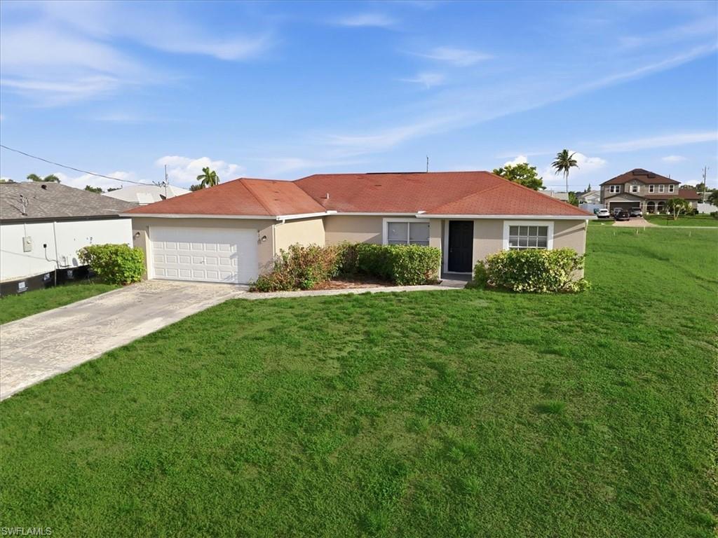 3-bedroom, 2-bath home offering an open-concept layout with tile flooring throughout the main living areas. Freshly painted and move-in ready, this home features vaulted ceilings that enhance the spacious feel of the living and dining areas. The kitchen overlooks the main living space, making it easy to stay connected while cooking or entertaining. The primary suite includes an en-suite bathroom and ample closet space, while two additional bedrooms provide flexibility for guests, a home office, or hobbies. Step outside to the screened lanai—an ideal spot to enjoy your morning coffee or unwind in the evening. The generously sized yard offers plenty of room for outdoor living, gardening, or future enhancements. A new construction home is being built on the adjacent lot, contributing to the area's continued growth and development. Conveniently located near shopping, dining, schools, parks, and major roadways, this home offers easy access to everything Southwest Florida has to offer. Whether you're searching for a primary residence, seasonal getaway, or investment opportunity, this property is ready for its next owner.