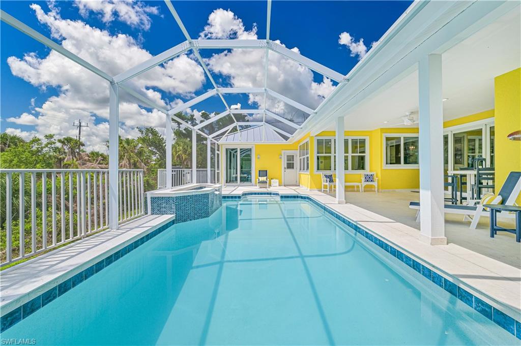 Completely renovated from top to bottom and reimagined with uncompromising attention to detail, this exceptional near-beach Sanibel Island residence is essentially brand-new construction. Designed to blend effortless coastal elegance with modern luxury, this 5 bedroom / 7 bath home offers an extraordinary combination of comfort, sophistication, and functionality.

Every element has been thoughtfully curated, from the floor plan to the high-end finishes and designer furnishings to the gourmet chef’s kitchen featuring every conceivable amenity perfect for entertaining family and guests alike.

Offering five to six bedrooms (den is convertible to a bedroom) and seven bathrooms, this spacious home can accommodate up to 12 guests and includes two luxurious primary suites while every guest bedroom features its own en-suite custom bath, creating the ultimate retreat for family and visitors.

Additional upgrades and amenities throughout (too many to list here) include impact-resistant windows and doors, all-new electrical, new air conditioning and plumbing systems, a brand-new metal roof, whole-house generator, professional landscaping with irrigation, a custom outdoor firepit, and a private resort-style saltwater pool and full laundry room with double washers and dryers provide the ultimate convenience for both everyday living and vacation hosting. No detail was overlooked in the transformation of this remarkable property.

Ideally situated in the heart of Sanibel Island on a rare and private 1.2-acre parcel, the home is just a short walk or bike ride to Sanibel’s world-renowned beaches, charming restaurants, boutique shopping, and miles of scenic bike paths.

Whether envisioned as a private family compound, luxury second home, or premier income-producing vacation rental with strong established revenue history, 335 Cowry Court represents a truly rare island opportunity. Offered fully furnished, turnkey, and move-in ready, this is Sanibel luxury living at its finest.