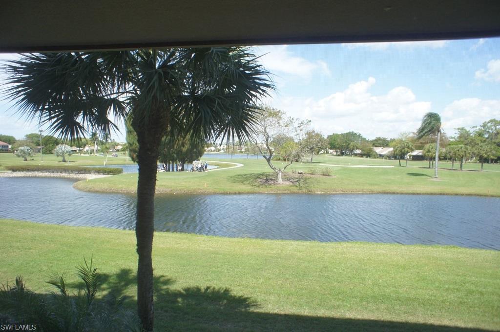 BEAUTIFUL WATER VIEWS for this updated Oxford model in Bldg. 21A. Common elevator available.  Stackable washer & dryer in the condo. Sit and relax in the Florida room while you watch the wildlife and the golfers on the golf course.  Kitchen is updated and there is tile flooring in the kitchen, dining room, hall, and baths.  A/C was installed in 2013 and there are newer vanities and commodes for baths.  Covered carport is included in the sale. Seven Lakes is an award winning golf & tennis community where you will enjoy the 18 hole executive golf course , 6 tennis courts, bocce, shuffleboard, billiards, exercise room and so much more. Location in Lee County is AAA plus. Close to beaches, shopping and restaurants. A tour of the Community Center is definitely worth your time. Come and Enjoy!