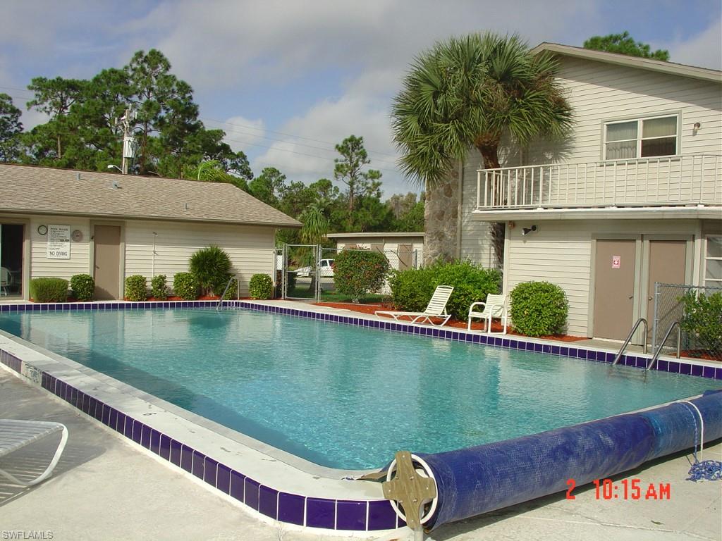 This unit overlooking the old Lochmoor Golf Course is nicely updated. The kitchen cabinets are new and the entire first floor is tiled including closets. This townhouse is layed out very nicely -- both bedrooms are upstairs each with their own bathrooms. Downstairs is a nice sized half bath. Screened and tiled lanai overlooks a pond while the upstairs master bedroom has an open deck overlooking the golf course. A lot of updates in this unit compared to some of the others: hurricane proof slider, hot water heater, cabinets, etc. Also include a storage closet on the end of the carport, a heated pool and a club house. The HOA is fully funded meaning this unit can easily be financed. Bring your buyers before it is gone . . .  Easy to show, vacant and on SUPRA.