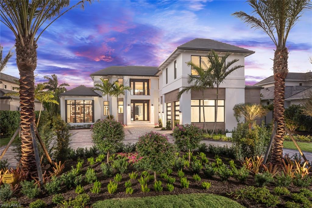 Built to the highest standards by Wilbrett Construction Company this newly constructed home offers sophisticated, stylish living spaces and is furnished to perfection by Adelyn Charles Interiors. Upon entering this 2-story full concrete construction home, you are greeted by the inviting open concept with Andersen Weiland pivot and lift-slide impact doors, glass enclosed wine room, fully stocked wet bar, and an opulent chef's inspired kitchen with butler's pantry. The main level primary suite offers a handsome study, spa-like bath, exquisite his and her walk-in closets and floor to ceiling windows that overlook the beautiful western water views. Artfully appointed with unique wall coverings, custom millwork, boutique closets in all guest suites, intricate ceiling details, 60 KW whole house generator, Lutron Lighting, smart-home capabilities, a private elevator at garage level and 240 volt electric car receptacle in the oversized 3-car garage. Each guest en-suite on the 2nd level offers generous spaces and have a unique personality of their own. Family and guests will enjoy the privacy of their own club room with a wet bar and 2 covered balconies. The outdoor oasis boasts the perfect spot for open-air entertaining with a resort-style infinity pool, sunken spa, water feature, see through fire place and a secluded fire pit at the water's edge for entertaining.
Prestigious Port Royal Membership Eligibility comes with the purchase of this home.