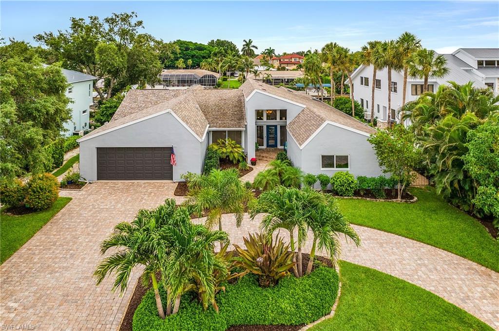 Welcome to your private waterfront retreat in the heart of Whiskey Creek! This spacious 5-bedroom, 3-bath home offers the perfect blend of comfort, functionality, and Florida waterfront living. From the moment you step through the grand foyer, you'll appreciate the thoughtful design, beautiful hardwood floors, abundant storage, and generous living spaces throughout.
The stunning gourmet kitchen is the centerpiece of the home, featuring extensive cabinetry, expansive countertop space, and an open layout that seamlessly connects to the family room, dining area, and pool deck—ideal for entertaining family and friends.
Step outside and experience true Florida living. Relax beside the heated saltwater pool, grill under the covered outdoor entertaining area, or cast a line from your oversized walk-around dock complete with a newer boat lift. Watch dolphins, manatees, and a variety of native birds play in the canal while enjoying the peace and serenity that surrounds this exceptional property. With quick boating access to open water, every day feels like a vacation.
Situated on a quiet residential street with two cul-de-sacs, this home enjoys minimal traffic and offers the perfect setting for walking, biking, and enjoying the outdoors. The circular paver driveway and expansive parking area provide plenty of room for guests, while the oversized two-car garage offers additional storage and workspace.
Conveniently located just minutes from the McGregor corridor, downtown Fort Myers, area beaches, dining, shopping, and entertainment, this incredible waterfront home truly has it all. If you've been searching for space, privacy, boating access, and an unbeatable location, this is the one you've been waiting for. Schedule your private showing today!
