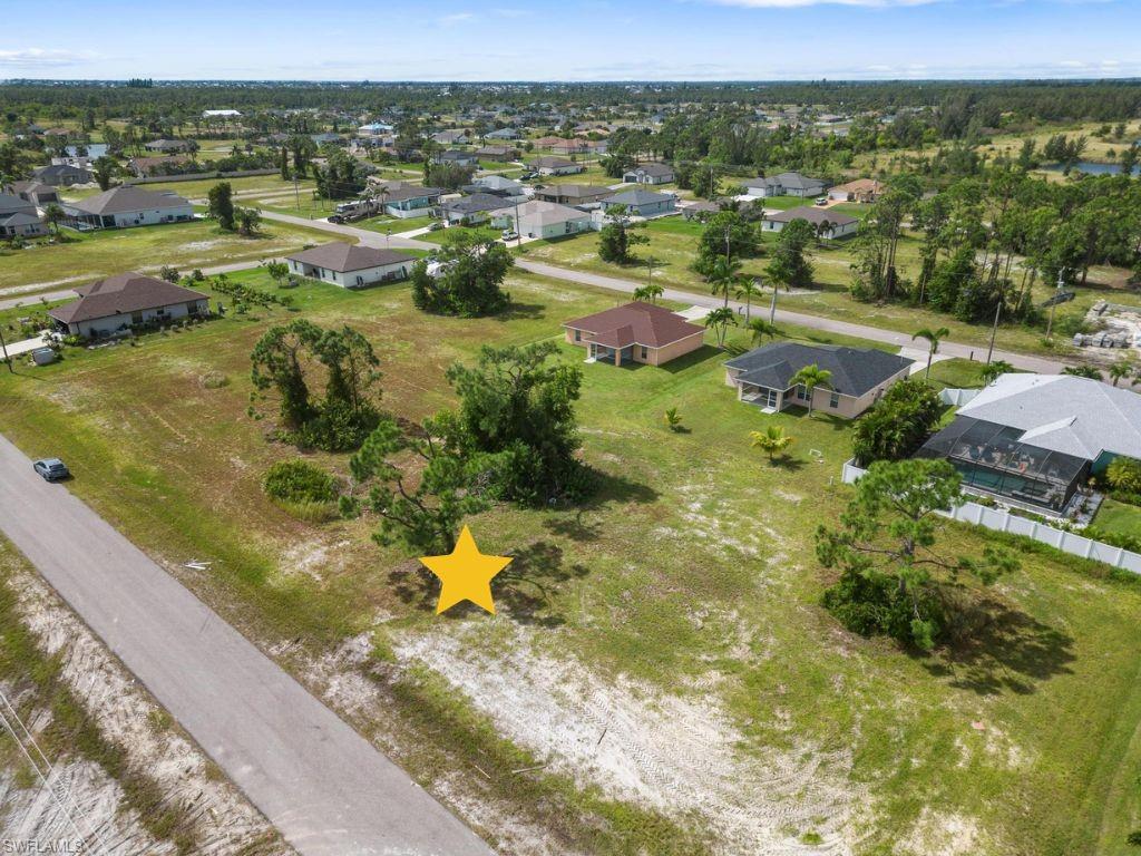 Welcome to your dream property! This 80 x 125 dry lot is your blank canvas, awaiting your creative touch to build the custom home you've always envisioned. Whether you're a homeowner seeking the perfect space to bring your dream home to life or an investor looking for a promising opportunity, this property has it all. Situated in a prime location, this lot is just a stone's throw away from the vibrant Pine Island shopping district. But that's not all, the Kismet Parkway biking and walking path is just around the corner, providing a picture-perfect setting for your evening strolls or morning bike rides. Additionally, commuting will be an absolute breeze as you're just minutes away from Burnt Store Road, El Dorado Blvd and Kismet PKWY, offering convenient access to any parts of the region. Imagine the freedom and flexibility this location gives you, making everyday commuting seamless and stress-free. Whether you're seeking a peaceful sanctuary for your family or an investment opportunity with incredible potential, this property is the answer. Don't miss out on this chance to create your own oasis in the heart of Cape Coral.This is your opportunity to own a piece of paradise!