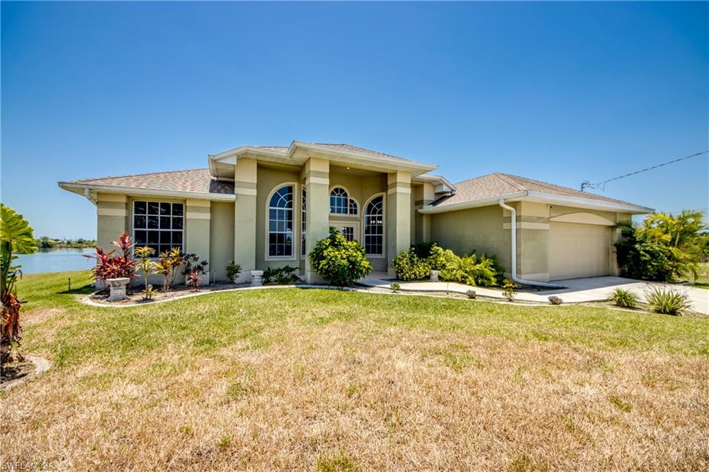 Lakefront Oasis with Stunning Panoramic Views, Pool & Modern Upgrades – Cape Coral, FL
Imagine waking up to breathtaking panoramic views across Garden Lake every morning. This exceptional 4-bedroom, 2-bath lakefront home delivers the ultimate Florida lifestyle with direct lake access, no flood zone concerns, and a fresh, move-in-ready appeal.
Recent major updates include a brand-new roof, A/C system, flooring, lighting fixtures, and hurricane-impact lanai doors and windows for ultimate peace of mind during storm season. Inside, the bright, open-concept design is perfect for both everyday living and entertaining. The expansive great room seamlessly connects to a chef-friendly kitchen featuring maple cabinets, granite countertops, a large center island, and breakfast bar—ideal for holiday gatherings and family dinners.
The luxurious primary suite offers private pool access, generous walk-in closets, and a spa-like bath with dual vanities, a separate shower, and a deep soaking tub. The three additional bedrooms are spacious and versatile, easily accommodating guests, a home office, or hobbies.
Outside, your private resort-style retreat awaits: a newly screened mansard lanai surrounds the sparkling in-ground pool, creating the perfect setting for sunny afternoons and serene lakefront sunsets. The interior and exterior have been freshly painted, giving the home a crisp, modern feel throughout.
Additional Highlights:

Oversized garage with ample storage or workshop space
Video surveillance cameras for added security
Strong Airbnb / short-term rental income potential for investors
Prime location near parks, shopping, dining, boating, and recreational opportunities

Whether you're looking for a forever home or a high-performing investment property, this Cape Coral lakefront gem checks every box. Don’t miss your chance to own a slice of paradise!
Schedule your private showing today and experience the beauty and tranquility for yourself.