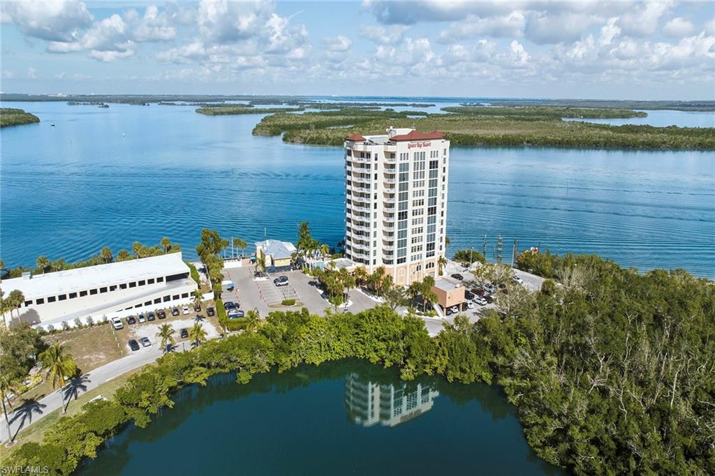 Residence 903 at 8771 Estero Boulevard presents a one-bedroom, one-bath condominium in Lover’s Key with direct water views and a thoughtfully updated interior. Positioned to capture expansive coastal vistas, the residence offers a functional layout suited for full-time living and seasonal use. The interior has been renovated with wood-look flooring throughout, creating continuity across the living spaces. The kitchen is appointed with stainless steel appliances, a tile backsplash and efficient workspace design. The bath features tile detailing in the shower, reflecting the residence’s updated condition. Floor-to-ceiling sliding glass doors in the great room and bedroom introduce natural light and provide direct access to the private balcony. This outdoor space serves as an extension of the living area, offering unobstructed water views and a setting for daily enjoyment of the surrounding environment. The bedroom suite is positioned to maximize the view corridor, while maintaining privacy and comfort. The open-concept great room allows for flexible living and dining arrangements, supporting a range of lifestyle preferences. Community amenities include an on-site restaurant, resort-style pool, fitness center and additional services designed to enhance convenience and recreation. The location within Lover’s Key places residents near coastal preserves, beaches and outdoor activities, reinforcing the property’s connection to its natural surroundings.