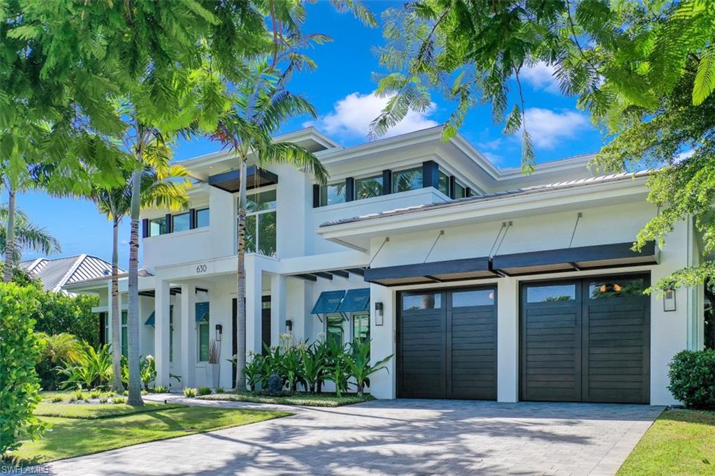This Old Naples custom coastal contemporary home exudes class, attention to detail and the best living Naples has to offer. Completed in 2015, this 4 bedroom plus den/office, 4 full bath/2 half bath, 3 car garage custom home with rear alley access boasts over 4,400 square feet of generous space. The features of this home bring nature and water into the interiors for a relaxing and elegant lifestyle. The custom glass stair case, interior and exterior linear fireplaces, outdoor pool/spa area, and outdoor teak shower are just a few features that show the generous care and investment made into the construction of this home. Situated on an oversize lot and quiet street with little to no thru traffic, and close proximity to the beach, it is easy to see the great value in this property at just over $900/ft! Completed in collaboration with Milestone Builders, and Jen Zella with CID Design Group. Enjoy all Old Naples has to offer in this incredible home.