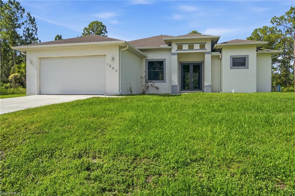 Welcome home to this beautifully maintained 4-year-old residence that offers the perfect blend of modern design, quality craftsmanship, and peaceful country living. Situated on a spacious ½-acre lot, this move-in-ready home features an open-concept floor plan with tile flooring throughout, providing both style and easy maintenance.  The heart of the home is the stunning chef's kitchen, complete with an oversized center island, upgraded cabinetry, premium finishes, and plenty of counter space—perfect for entertaining family and friends. Designer touches continue throughout the home with upgraded finishes, energy-efficient LED lighting, and a bright, welcoming interior.

A spacious den adds incredible flexibility to the floor plan and can easily be used as a home office, media room, playroom, or converted into a fourth bedroom to accommodate your family's changing needs.  Spacious bedrooms, indoor laundry, tray ceilings, granite countertops and tall ceilings provide added comfort and functionality to this home. Step outside to the extra-large covered lanai, an ideal space for relaxing with your morning coffee, hosting weekend barbecues, or enjoying Florida's beautiful year-round weather while overlooking your expansive backyard.  There is plenty of room for a pool or shop.

With the benefits of newer construction without the wait to build, this home offers peace of mind, modern features, and room to grow. Whether you're a first-time homebuyer, looking to upgrade, or searching for a home with extra outdoor space, this exceptional property is one you won't want to miss.  Schedule your private showing today and discover why this beautiful home is the perfect place to call your own!