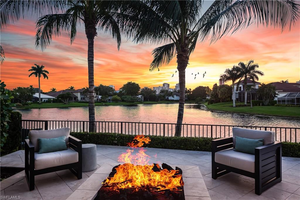 One of the most stunning SW exposure lake views in all of Park Shore. Enjoy vibrant sunsets from this newer construction home comprised of 4 bedrooms, 4 full/2 half baths, office, exercise room, 3 car temperature controlled garage, multiple living spaces, gourmet eat-in kitchen, butler’s pantry, wet bar. Immediately upon entering natural light fills the soaring ceilings and flows throughout the open floor plan. Outdoor living offers dining, summer kitchen, fireplace, pool bathroom, all enclosed with electronic roll down screens & hurricane shutters. Relax by the lakeside fire pit or inside the 45' heated salt water swimming pool/spa. Home has been completed with custom built-in storage, Lutron roller shades, extensive built-in Sonos speakers, home security with cameras, and whole house generator. Ideally located in the heart of Naples. Park Shore residents enjoy close proximity to Park Shore member only beach access, upscale shopping and dining options such as The Village at Venetian Bay, Fifth Avenue, Waterside and Mercato. Voluntary membership to the private Park Shore Association and the option to lease/purchase a boat slip at Venetian Bay Yacht Club is available.