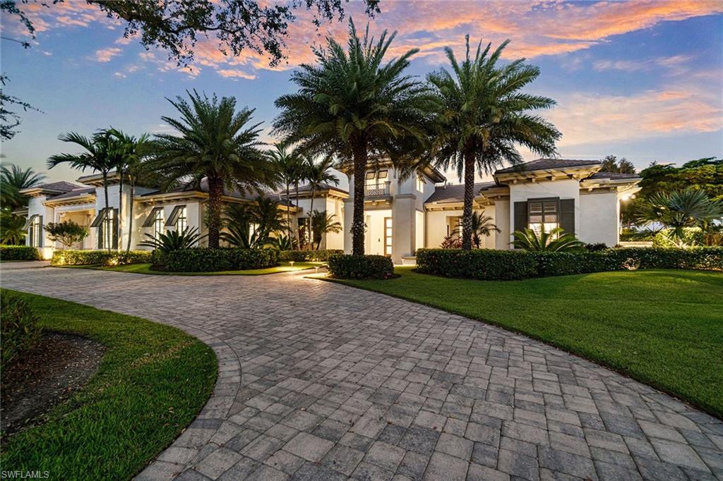 In the sought-after community Quail West in Naples, this stunning property offers a blend of elegance, comfort and convenience. In a tranquil and upscale neighborhood, it provides easy access to the best Naples has to offer, including world-class beaches, shopping, dining and golf courses. This exquisite turnkey home features two owner’s suites, two guest suites, plus den, five baths and 5,938 square feet of living space, designed with an open-concept layout to maximize privacy and entertaining. The wine room is conveniently in the dining room. The gourmet kitchen is equipped with top-of-the-line appliances, sleek countertops, double islands and custom cabinetry, ideal for culinary enthusiasts. A spacious living area boasts expansive windows that flood the space with natural light and provide picturesque views of the surrounding lush landscape. The primary suite is a serene retreat, featuring a magnificent closet with custom built-ins, Druzy Quartz stone, a built-in desk and dressing area. This space can be more than a closet and can serve as multifunctional for multiple uses. A spa-like bath with a soaking tub, walk-in shower and dual vanities. The home’s other bedrooms are generously sized and offer ample closet space. Outside, the backyard oasis invites you to relax and enjoy the year-round Florida sunshine. Whether you’re lounging by the heated pool, dining alfresco in the screened-in lanai, sitting by the fireplace or enjoying the beautifully landscaped grounds, this home offers the ultimate in outdoor living. Additional features include a four-car garage, a large laundry room, high ceilings, custom built-ins throughout with designer finishes. This former model by Stock Custom Homes was built as a 4,427-square-foot, then in 2024 an additional 1,638 square feet was added, making this home 6,000-plus square feet. The Cristale is move-in ready and includes a whole-house generator, impact glass throughout, electric retractable lanai screens, electric metal hurricane shutters, Control4 for lighting, security and music throughout the home, all new gutters and roof tiles to the original home in 2024. With its prime location, on a quiet street and exceptional design, this property is the ideal place to call home in Naples. This is a rare opportunity to own a piece of paradise in one of Southwest Florida's desirable areas. Quail West offers two championship golf courses, racquet sports, 12,000-square-foot fitness center, and multiple indoor and outdoor dining facilities. Don't miss out on this exceptional home! Immediate golf available!