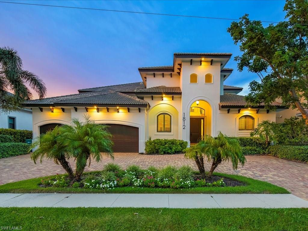 Experience the pinnacle of coastal luxury at 1812 Maywood Ct, a newly renovated including brand new AC units, two-story contemporary waterfront home that blends elegant design with modern comfort. Boasting over 4,200 square feet of air-conditioned living space and more than 5,800 total square feet, this exceptional residence offers a versatile layout ideal for family living and grand-scale entertaining. Step inside to soaring 30-foot ceilings in the dramatic foyer, where light floods through expansive windows and reflects off luxury vinyl plank flooring that flows seamlessly throughout. The heart of the home is the chef-inspired kitchen, thoughtfully appointed with an induction oven, wine cooler, walk-in pantry, and a generous central island that opens to an expansive great room. A formal dining room accommodates memorable family meals with ease. Featuring five spacious en-suite bedrooms, this home ensures privacy and comfort for all. An upstairs loft with wet bar and private lanai invites you to unwind while taking in tranquil views of the Gulf waters. Detailed tray ceilings, intricate crown molding, and thoughtfully curated finishes elevate every corner. An elevator provides effortless access between floors, and the spacious three-car garage offers plenty of storage. Outside, a brand-new dock and boat lift await your next aquatic adventure, all nestled on a quiet cul-de-sac setting. Located just minutes from Marco Island’s world-famous white sand beaches, upscale shopping, and award-winning dining, 1812 Maywood Ct is a rare opportunity to live the ultimate waterfront lifestyle in a truly remarkable home.