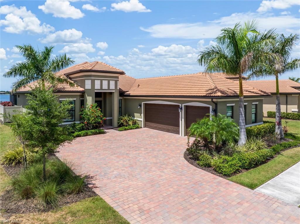 Experience the perfect blend of luxury, privacy, and Florida lifestyle at 553 Maraviya Boulevard, located within the highly sought-after Toscana Isles community of Nokomis. Rarely does a home combine an oversized waterfront homesite, private resort-style outdoor living, and proximity to Venice’s award-winning Gulf beaches in one exceptional offering. Positioned on one of the community’s premier oversized homesites, this exceptional residence showcases expansive long-lake views and a setting designed for elegant entertaining and everyday enjoyment. The open-concept floor plan features tray ceilings, crown molding, designer finishes, abundant natural light, tile flooring throughout the main living areas, and comfortable carpeting in the bedrooms. The gourmet kitchen is beautifully appointed with quartz countertops, a spacious island, gas range, pantry, and butler’s pantry, all seamlessly connected to the great room. The owner’s suite offers a private retreat with custom walk-in closet built-ins, dual vanities, and a spacious walk-in shower. An interior laundry room includes cabinetry and a utility sink.  Step outside to your own private waterfront retreat featuring Travertine decking, a heated saltwater infinity-edge pool that appears to blend seamlessly into the expansive long-lake views beyond, and a custom stone outdoor kitchen complete with a stainless-steel gas grill, sink, and refrigerator. The expansive screened lanai is the perfect setting for morning coffee, sunset cocktails, or entertaining while overlooking the tranquil waterfront. Additional features include hurricane-impact windows, a hurricane-rated garage door, propane service, a Navien tankless water heater, and a water softener. Toscana Isles is renowned for its Tuscan-inspired architecture, beautifully maintained grounds, and more than 200 acres of interconnected spring-fed lakes. Residents enjoy an 8,000-square-foot lakefront clubhouse, resort-style infinity-edge pool, fitness center, pickleball and tennis courts, bocce courts, dog park, fishing, kayaking, canoeing, and a full calendar of activities coordinated by an on-site lifestyle director—all within a secure, gated community.  Ideally located just east of Interstate 75 off Laurel Road, you’re approximately 10 minutes from Nokomis Beach, Venice Beach, and historic downtown Venice, with Sarasota’s renowned arts, dining, shopping, and cultural attractions only 20 minutes away. Because luxury is more than a home—it’s a lifestyle. INFORMATION IS DEEMED RELIABLE BUT NOT GUARANTEED. BUYER AND/OR BUYER’S AGENT TO VERIFY ALL INFORMATION.