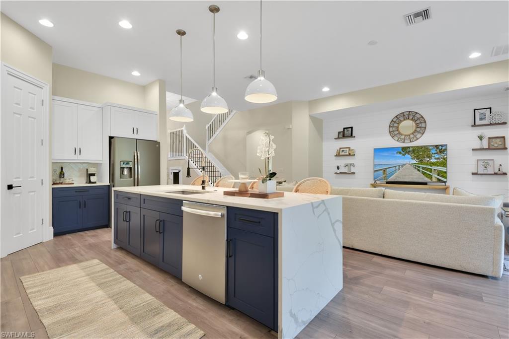 Fantastic 2-story layout! You will love what this home has to offer - custom trim work, volume ceilings, designer light fixtures & fans, high-end vinyl flooring (lifetime warranty & waterproof), custom sliding barn door on den & custom wood door at top of staircase, gorgeous open concept kitchen, built-in seating in dining room, custom dog pen door on staircase, wood slat garden wall on spacious rear lanai, and fenced in backyard. Comfortable floor plan w/ a great room design & split bedroom floor plan w/ the master bedroom on first floor along w/ the den and the 2 guest rooms are on second floor. Tuscany Pointe is a beautiful gated community situated in Naples that features single family homes w/ pavers on all driveways & tropical landscaping throughout. Very convenient location- close to I-75, only 20 minutes from Vanderbilt Beach, and just 7 miles from the shopping & dining of MERCATO.