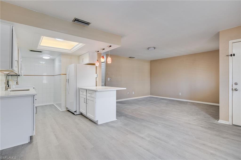 Gorgeous renovated ground floor unit in a desirable and private 55-plus complex with only 10 units and a large communal pool. Just down the street from Cape harbor, Camelot Isles Shopping Center and Rum Runners, this condominium is extremely centrally located. Featuring two spacious bedrooms and an open concept kitchen, dedicated parking, an expansive patio and storage unit, prospective buyers will find this unit is well equipped and a great value for the asking price. Additionally, the entire unit was renovated recently with no expense spared, including sparkling quartz countertops, shaker cabinets, new waterproof LVP flooring, paint and more! The association is in good financial shape, with HOA fees including water, insurance, pool care, garbage pickup and pest control. Make a showing appointment today, this one won't last long.