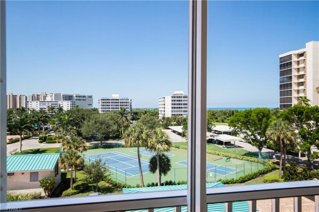 This remodeled 4th floor condo offers both Gulf & Bay views and is walking distance to the Gulf of Mexico! Updates include, granite countertops, cabinetry, tile flooring throughout main living areas, brand new carpeting, electric hurricane shutters, newer water heater, washer and dryer. Enjoy your coffee or a sunset cocktail from the comfort of your oversized lanai. This condo offers a spacious floor plan with over 1600 sq.ft., 3 beds and 2 full baths. Offered furnished allowing immediate occupancy without any hassle. Enjoy all of the amenities including heated swimming pool, barbecue area, tennis & pickle ball, bocce, fishing, and boat docks available for lease with direct access to the Gulf. Conveniently located around the corner from shopping at some of the finest boutiques and dining at top restaurants are within a few minute drive. Mercato, Pavilion, Waterside Shops and Artis Naples are just a few of the "HOT SPOTS" you will be able to enjoy! Gulf Breeze common areas, building exterior and lanais are currently being renovated and all assessments have been paid! UNDER BUILDING PARKING GARAGE for negotiated price! No need to step outside to access your car. DO NOT MISS OUT!