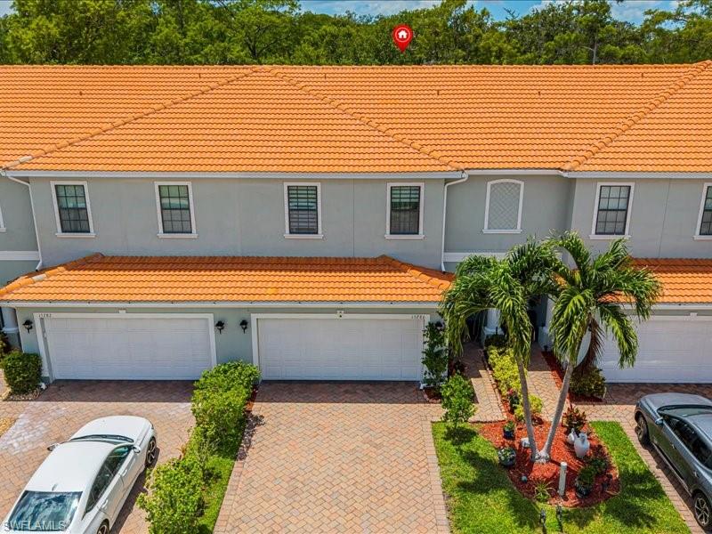 Welcome to your modern sanctuary in the heart of Naples. This beautifully updated 3-bedroom, 2.5-bath residence, built in 2013, offers approximately 1,800 square feet of thoughtfully designed living space and is perfectly positioned on a peaceful preserve-backed lot. Step inside to discover luxury hardwood-finish flooring throughout with NO carpet, freshly painted interior walls, and a bright open-concept living and dining area that flows seamlessly to the covered screened lanai. Enjoy your morning coffee or unwind in the evening while taking in tranquil preserve views and the privacy of nature. The kitchen is both stylish and functional, featuring premium cabinetry, generous prep and storage space, and all-new major appliances. Large windows and efficient lighting create a bright, polished, and welcoming atmosphere throughout the home. Oversized closets and a spacious two-car garage complete the interior offering. Designed for today’s lifestyle, this smart home allows convenient control of lighting, locks, cameras, and garage access directly from your phone, with compatibility for popular voice assistants. The garage is also equipped with a 50-amp EV charger, ready for Tesla and other electric vehicles. Located within a guard-gated community, residents enjoy resort-style amenities including a community pool and spa, fitness center, saunas, tennis and pickleball courts, clubhouse, BBQ picnic areas, playground, and more. Ideally situated just minutes from Naples’ world-famous Gulf beaches, Mercato, Waterside Shops, fine dining, shopping, entertainment, and with easy access to I-75, this location offers both convenience and lifestyle. Families will appreciate the highly rated school district, including a nearby 10/10 middle school. If you are seeking a move-in ready home that blends technology, comfort, community, and peaceful preserve views, this is an exceptional opportunity.

BONUS: The property includes a FREE one-year American Home Shield Home Warranty for added peace of mind.