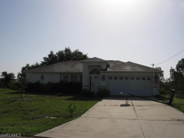 This 3 bedroom, 2 bath home in Woodridge Preserve located just South of S.R 82 with quick access to Fort Myers, cathedral ceilings, 5 ceiling fans, his and her closets in master bedroom, inside utility room with rinse tub, 14 X 9 screened porch, hurricane straps on garage door, extra shelving in garage, all appliances including microwave, washer and dryer, breakfast bar, nice neighborhood, not a foreclosure or short sale, quick closing, on city water and sewer.